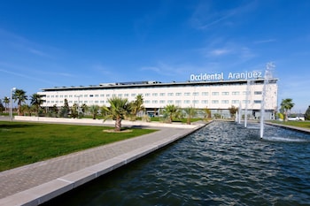 A water feature with a curved structure and a pool.
