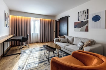 Indoor pool, open 6:30 AM to 10 PM, pool umbrellas, sun loungers