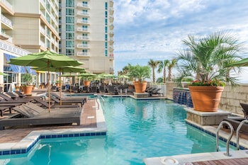 2 indoor pools, outdoor pool, open 8:00 AM to 10:00 PM, pool umbrellas