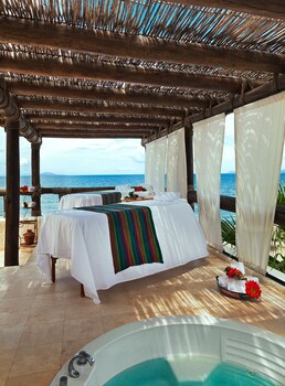 On the beach, sun-loungers, beach umbrellas, beach massages