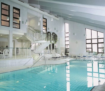 Indoor pool, open 7:00 AM to 11:00 PM, pool loungers