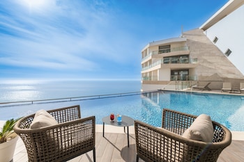 Indoor pool, outdoor pool, pool umbrellas, pool loungers
