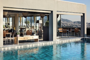 Seasonal outdoor pool, open 10:00 AM to 7:30 PM, pool umbrellas