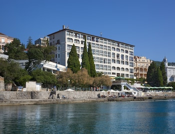 On the beach, white sand, sun loungers, beach umbrellas