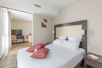 Relax in our spacious lobby, featuring a comfortable seating area, bar, and kitchen services.
