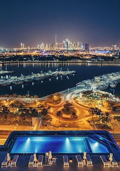 Outdoor pool, open 8:00 AM to 10:00 PM, free pool cabanas