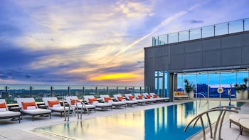 Outdoor pool, a heated pool, open 7:00 AM to 11:00 PM, sun loungers