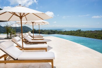 Outdoor pool, open 7:00 AM to 7:00 PM, pool umbrellas, sun loungers