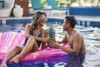 Outdoor pool, open 8:00 AM to 10:00 PM, cabanas (surcharge)