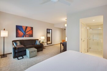 Premium bedding, desk, laptop workspace, blackout curtains