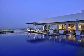 Breakfast, lunch, dinner served; Indian cuisine, pool views 