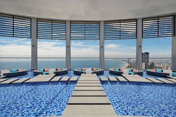 Outdoor pool, open 6:00 AM to 9:00 PM, sun loungers