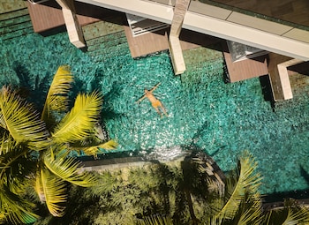 3 outdoor pools, open 8 AM to 8 PM, cabanas (surcharge), pool umbrellas