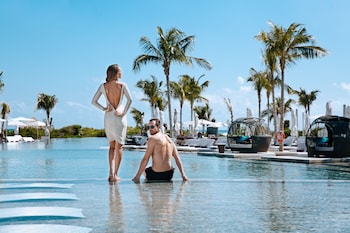 3 outdoor pools, open 8 AM to 8 PM, cabanas (surcharge), pool umbrellas