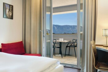 Standard Room, 1 King Bed, Balcony, City View (City View) | Minibar, in-room safe, desk, blackout curtains