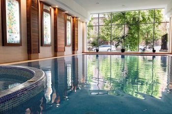 Indoor pool, open 5:00 PM to 9:00 PM, pool loungers