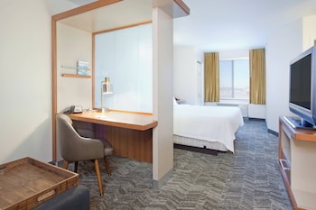 A Springhill Suites Marriott hotel with a modern facade, multiple windows, and a covered entrance area.