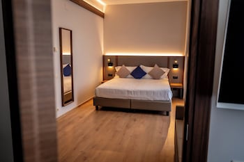A reception area with a sign reading "PORTA AL PRATO - THE RESIDENCE".