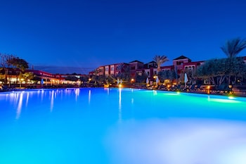Indoor pool, 3 outdoor pools, open 9:00 AM to 6:00 PM, pool umbrellas