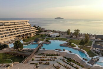 On the beach, white sand, sun loungers, beach umbrellas