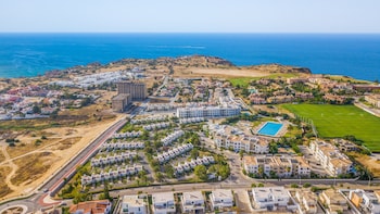 Beach nearby, white sand, sun loungers, beach umbrellas