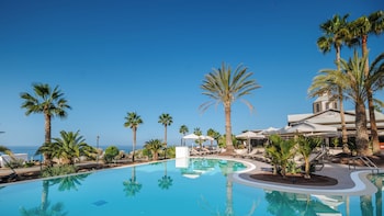 2 outdoor pools, open 9:00 AM to 6:00 PM, pool umbrellas, pool loungers