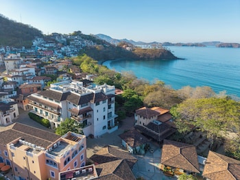 Outdoor pool, open 6:00 AM to 6:00 PM, pool loungers