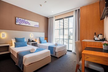 Signature Twin Room, Balcony, City View | Minibar, in-room safe, blackout drapes, iron/ironing board