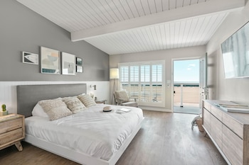 Suite, Patio, Ocean View | Living room | 52-inch flat-screen TV with cable channels, TV