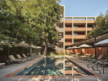 Outdoor pool, open 8:00 AM to 10:00 PM, pool umbrellas, sun loungers