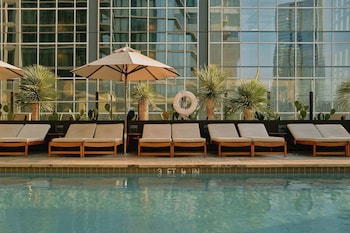 Outdoor pool, open 8:00 AM to 10:00 PM, cabanas (surcharge)