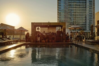 Outdoor pool, open 8:00 AM to 10:00 PM, cabanas (surcharge)