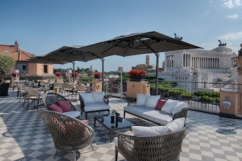 Enjoy a sophisticated dining experience with a view of a historic landmark from our rooftop terrace.