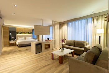 Experience the Sorrento Hotel's sleek, modern design, featuring a glass entrance and illuminated sign.