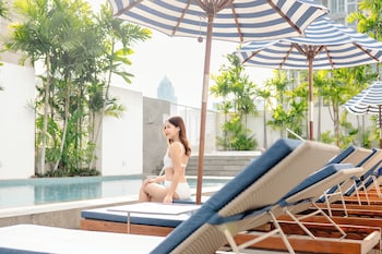 Outdoor pool, open 7:00 AM to 7:00 PM, pool umbrellas, sun loungers