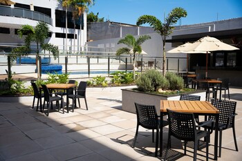 3 outdoor pools, open 10:00 AM to 10:00 PM, pool umbrellas