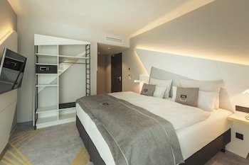 Contemporary interior with a statement wall featuring stylized text and geometric patterns.