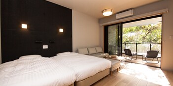 Down duvets, desk, laptop workspace, blackout curtains