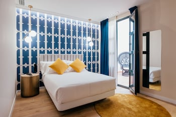 Suite estudio junior | Edredón, camas con efecto memoria y minibar