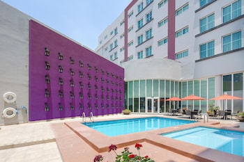 Outdoor pool, open 8:00 AM to 8:00 PM, pool loungers