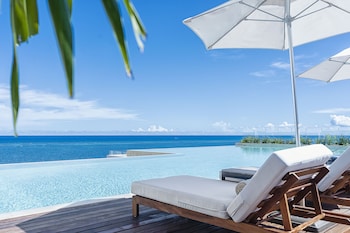 2 outdoor pools, open 7:00 AM to 7:00 PM, pool umbrellas, pool loungers