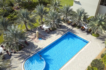 Outdoor pool, open 7:00 AM to 9:00 PM, pool umbrellas, sun loungers