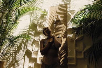 On the beach, white sand, beach umbrellas, beach towels