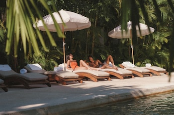 On the beach, white sand, beach umbrellas, beach towels