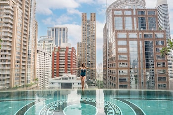 Outdoor pool, open 6:00 AM to 10:00 PM, pool umbrellas, sun loungers