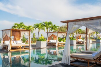 Outdoor pool, open 8:00 AM to 8:00 PM, free cabanas, pool umbrellas