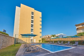 Outdoor pool, open 8:00 AM to 8:00 PM, pool umbrellas, pool loungers