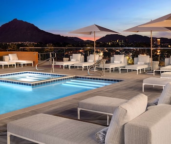 Outdoor pool, open 8:00 AM to 10:00 PM, cabanas (surcharge)