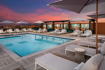 Outdoor pool, open 8:00 AM to 10:00 PM, cabanas (surcharge)