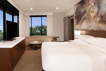 Delta Hotels offers a sleek, modern building with a mix of glass and solid facade elements.